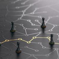 pawns on a board with dots and lines